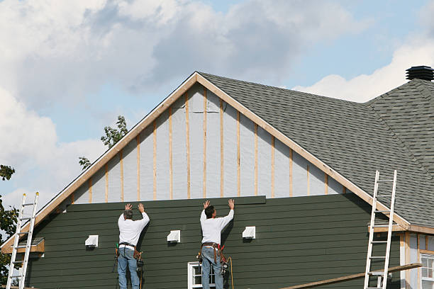 Professional Storm Damage Siding Repair technician working in Ferguson, NC